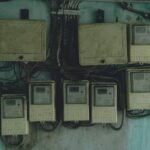 Aged and rusty electrical panels on an outdoor wall in Ho Chi Minh City, Vietnam.