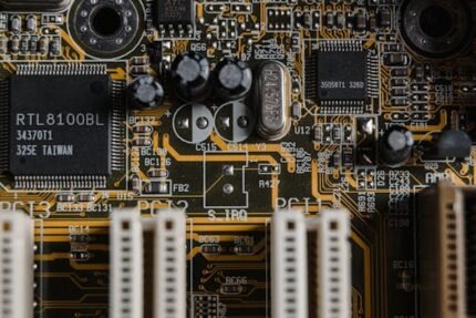 Detailed view of a motherboard with visible microchips and circuits.
